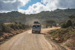 A minibus on a gravel road