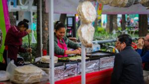 A person preparing street food