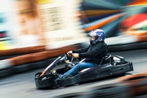 Person Riding a Go-Kart at High Speed
