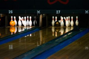 A Picture Showing a Bowling Ball and Bowling Pins
