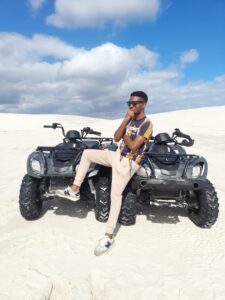 Modisha Sitting Next to 2 Quad Bikes