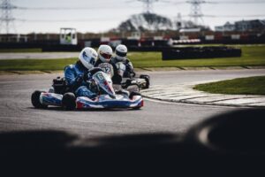 Three People Riding Go-Karts