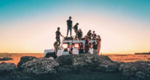 Tourists next to a truck